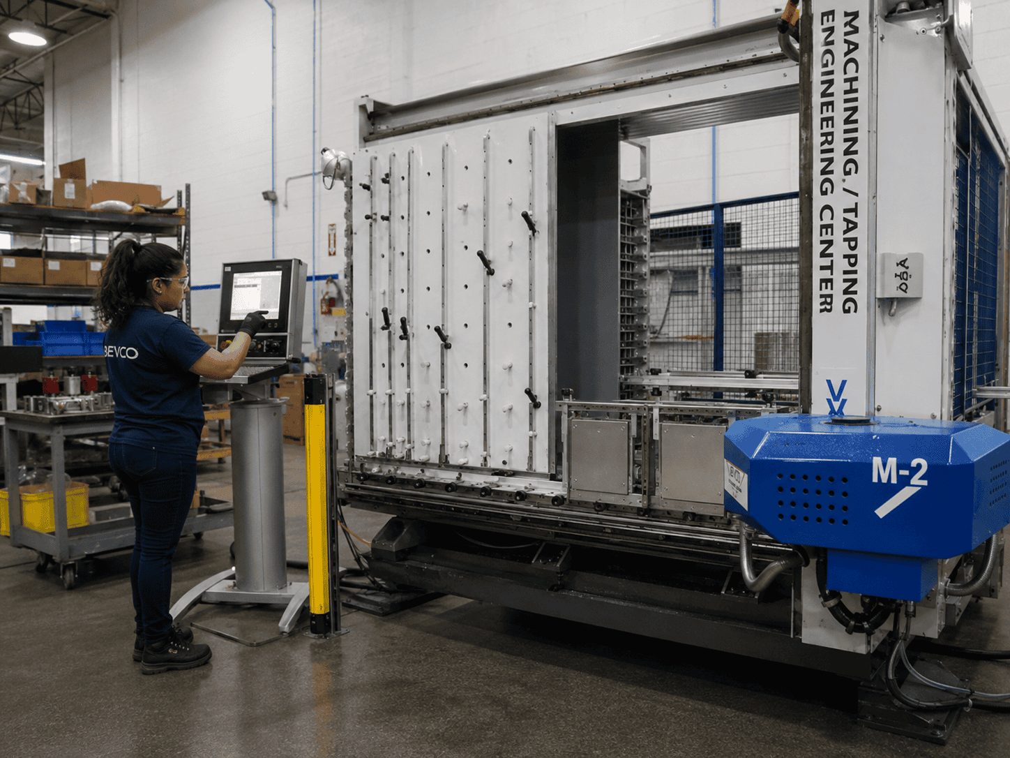 Woman operating a CNC machine.