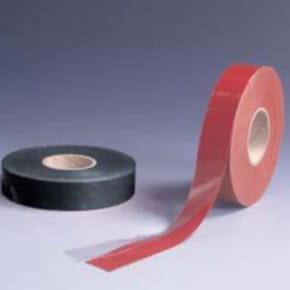black and red rolls of tape on blue background